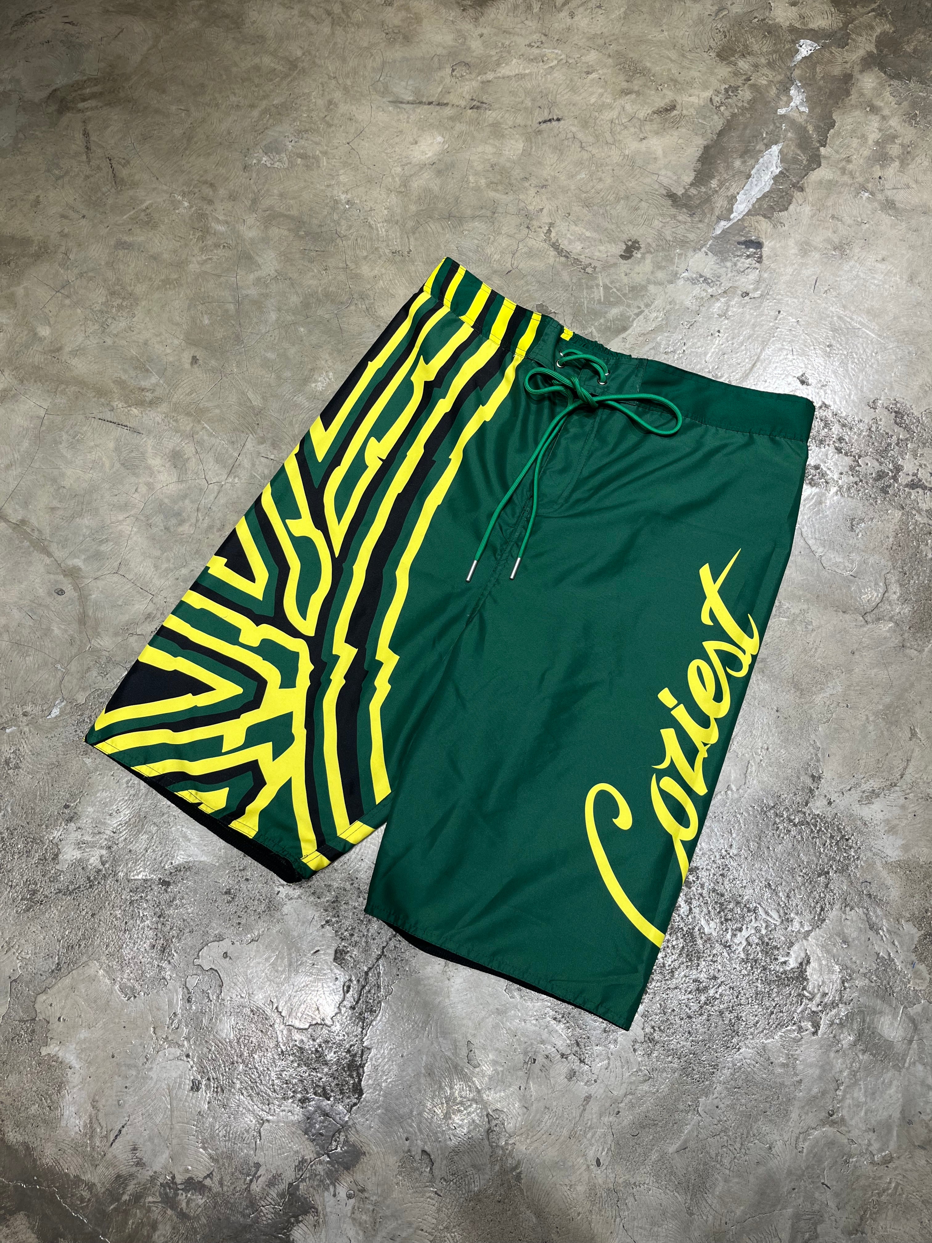 “26 Board Shorts” in Black, Green and White Colorway